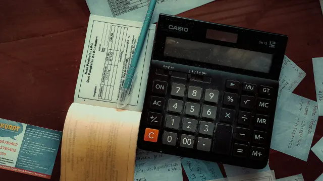 A calculator, checkbook, and cash help answer does budget billing save money.