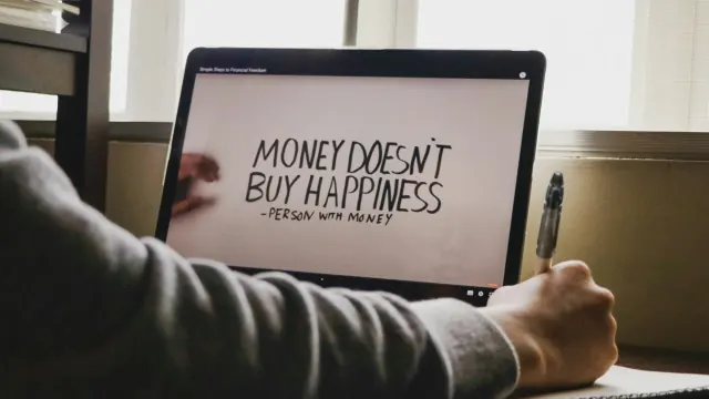 A laptop quote about money offers reflection for scriptures on saving money.