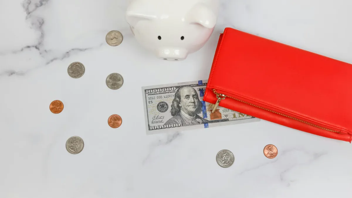 A piggy bank, wallet, bills, and coins support a saving money 52 week challenge.